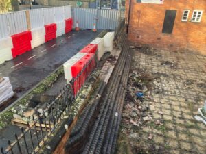 The wall and railings at the side of Ashbourne Methodist Church with a gap cut in it - this will be the new main entrance into The Link Centre.
