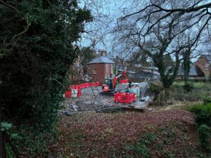 A digger working to remove the prefab hut from the grounds of Ashbourne Methodist Church 