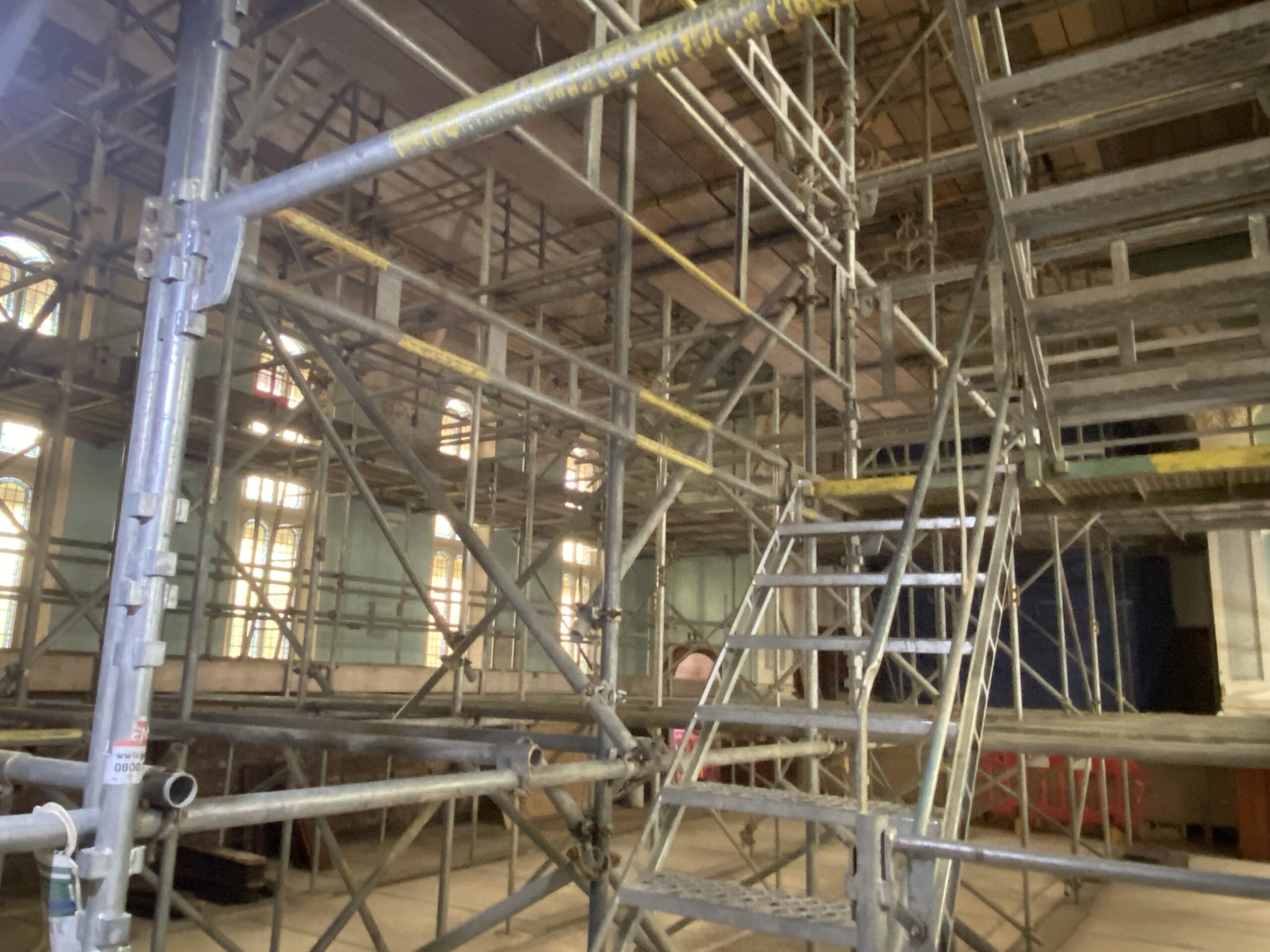 Photo of the inside of Trinity Hall at The Link Centre with scaffolding completely filling the space.