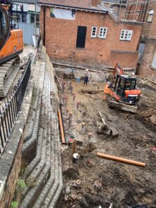 Work has finished on driving in the piles for the foundations of The Link Centre's new foyer. The piles are now being capped preparatory to the foundation slab being laid.