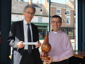 Councillor David Hughes of the Ashbourne Reborn Programme Board, and Revd Andy Fyall, Chair of the Nottingham & Derby District of the Methodist Church, with the time capsule and decorative finial.