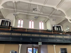 The balcony panelling is painted; the filigree work is regilded, and new feature lights are installed.