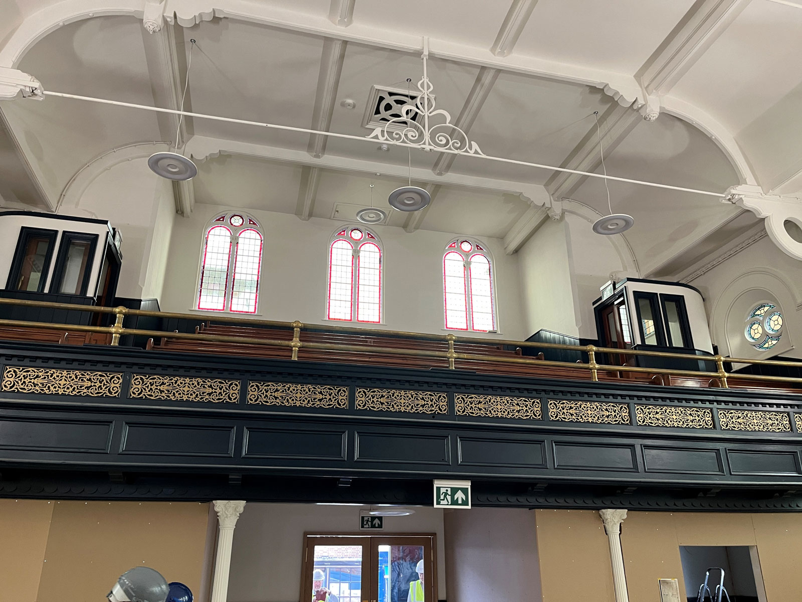 The balcony panelling is painted; the filigree work is regilded, and new feature lights are installed.