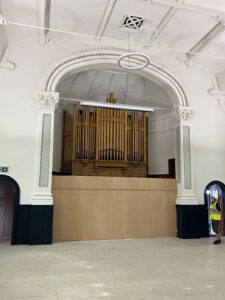 The organ is temporarily screened off – there will be a new wooden screen – to match the balcony panelling