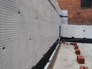 The Link structural floor slab is complete, as is the large retaining wall, and bricklaying for the Link wall has started