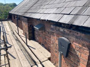 Bird and bat boxes that have been installed on the side of the building