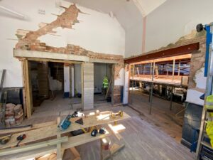 n the Cornerstone, walls have been reconfigured and the opening into the foyer has been made, together with the opening for the new servery and the accessible toilet.