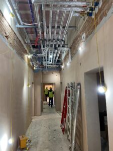 In Gateway Lodge the walls are plastered, and the plumbing and electrical cables are in place ready for the ceilings to be installed